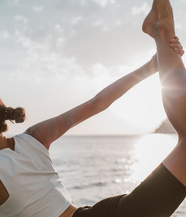 Woman in a calm yoga pose, embodying balance and tranquility.